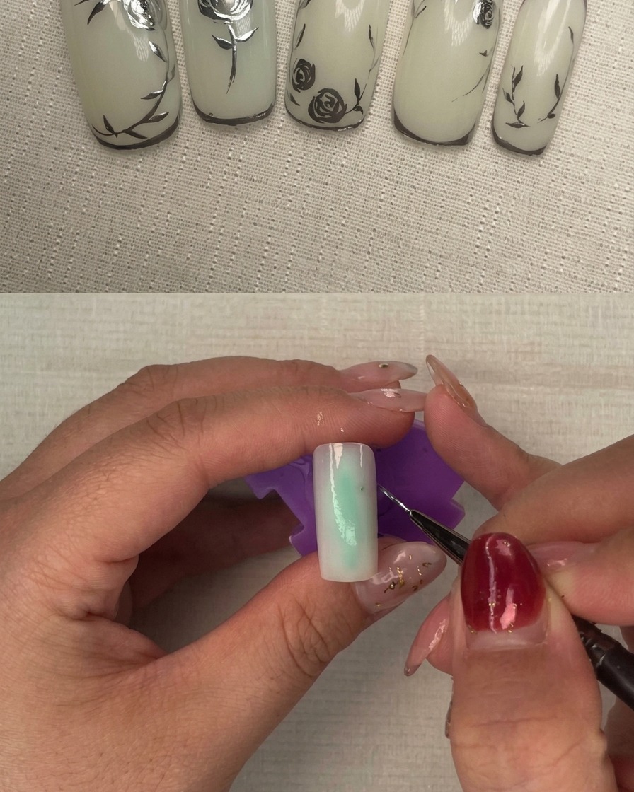 Un ongle avec une deuxième couche de vernis laiteux étant catalysé sous une lampe à ongles.