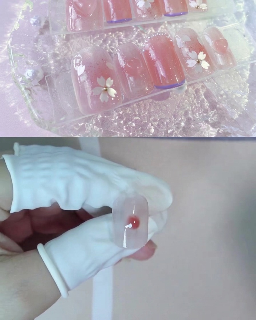 Une goutte de gel pêche nude plus foncé posée au centre du blooming gel humide sur un ongle.
