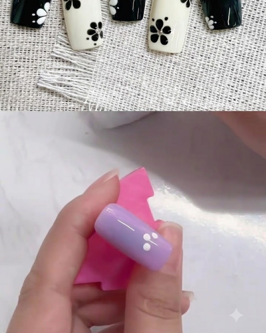 Gros plan dun ongle violet avec quatre points blancs disposés en cercle partiel.