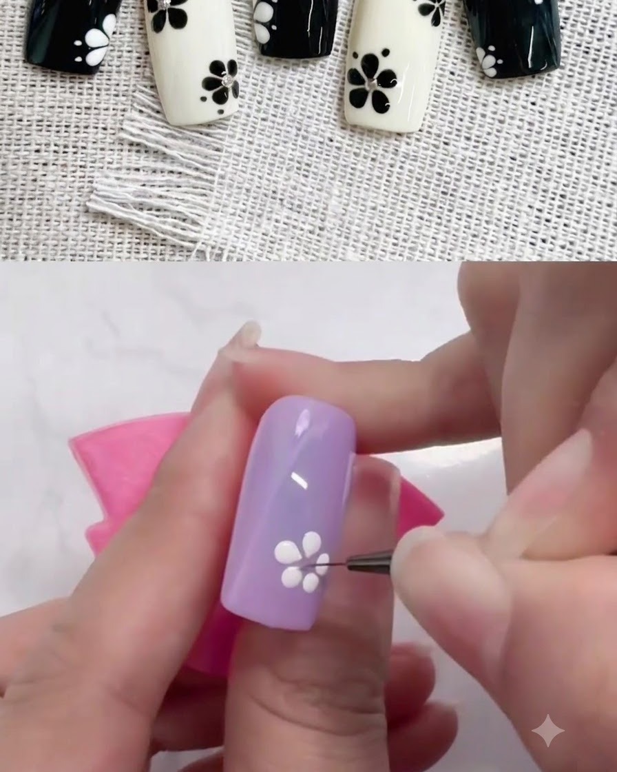 Un pinceau liner fin tirant les points de gel blanc vers lintérieur pour façonner les pétales sur un ongle violet.