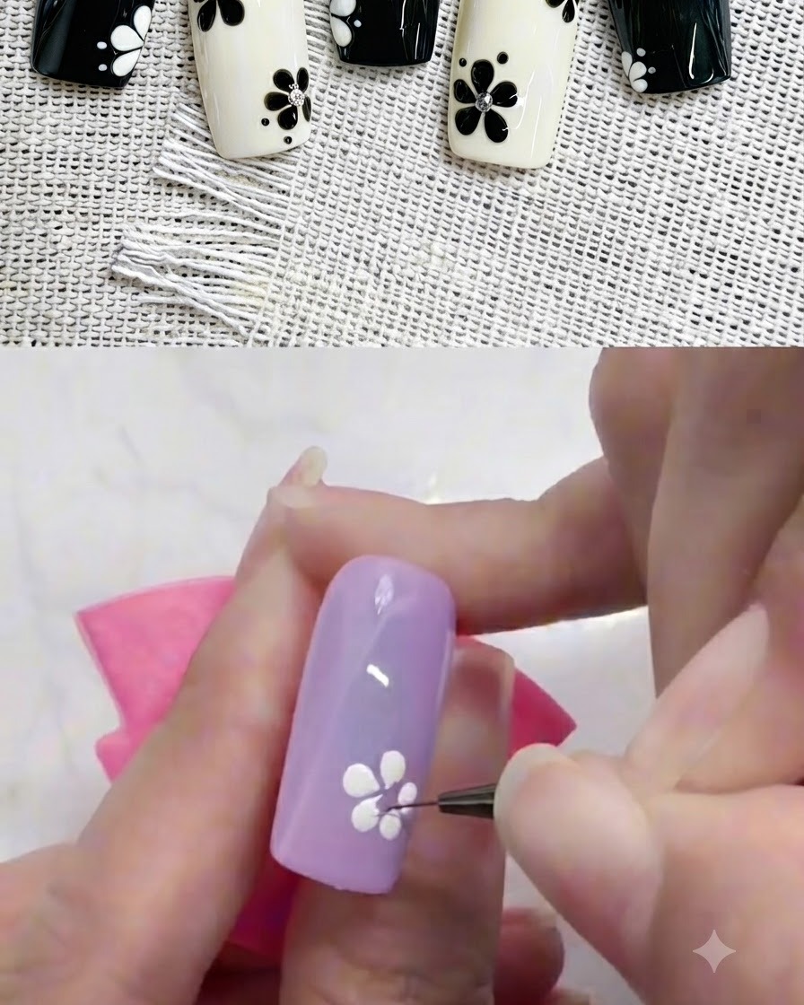 Un pinceau liner ajustant soigneusement la base dun pétale de fleur blanche sur un ongle coloré.