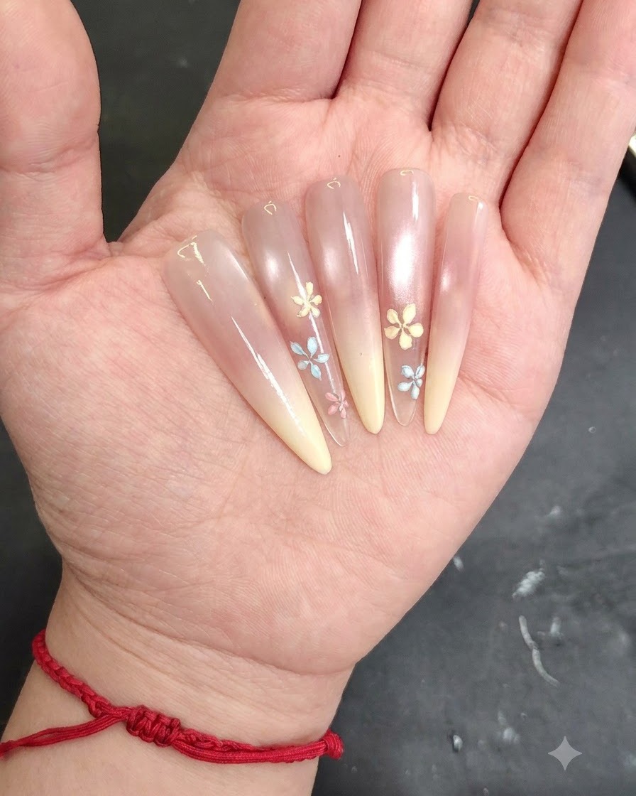 Gros plan de lapplication de gel de construction sur les pétales de fleurs pour un effet texturé 3D.