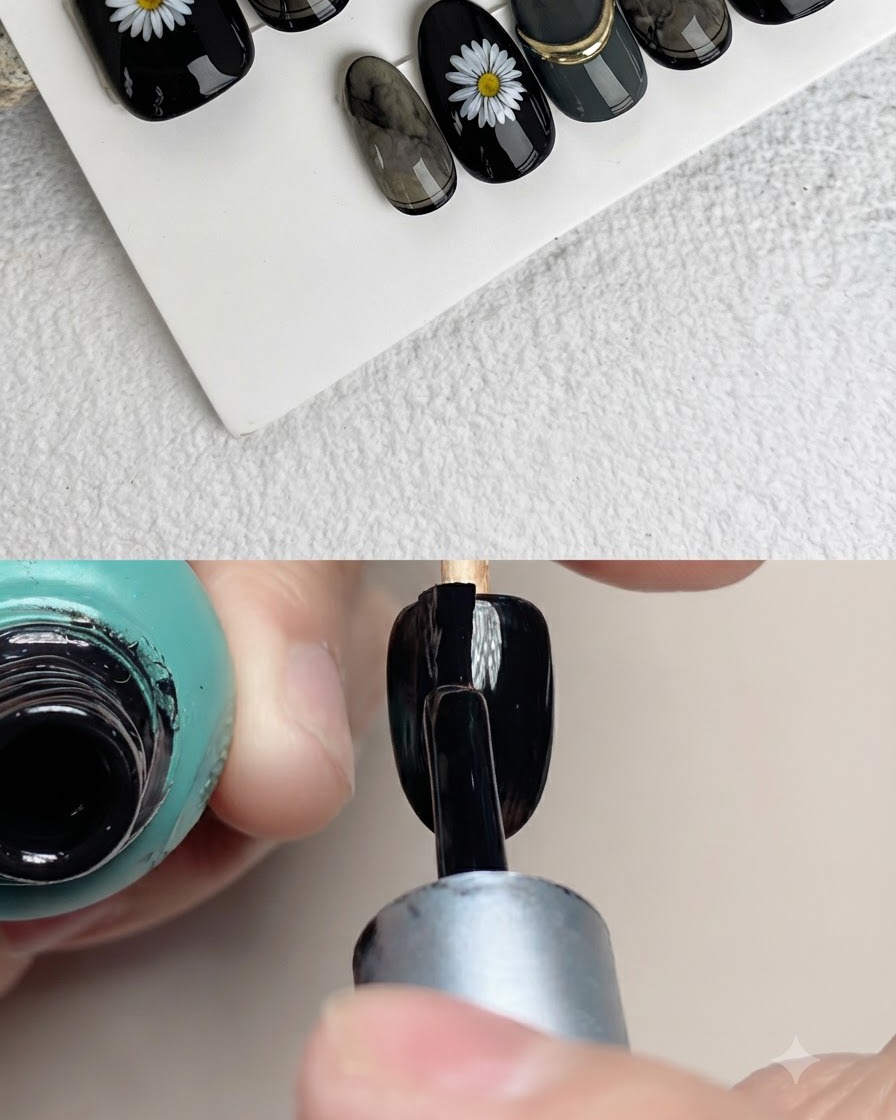 Gros plan dun pinceau à ongles appliquant des pétales blancs sur la surface dun faux ongle noir.