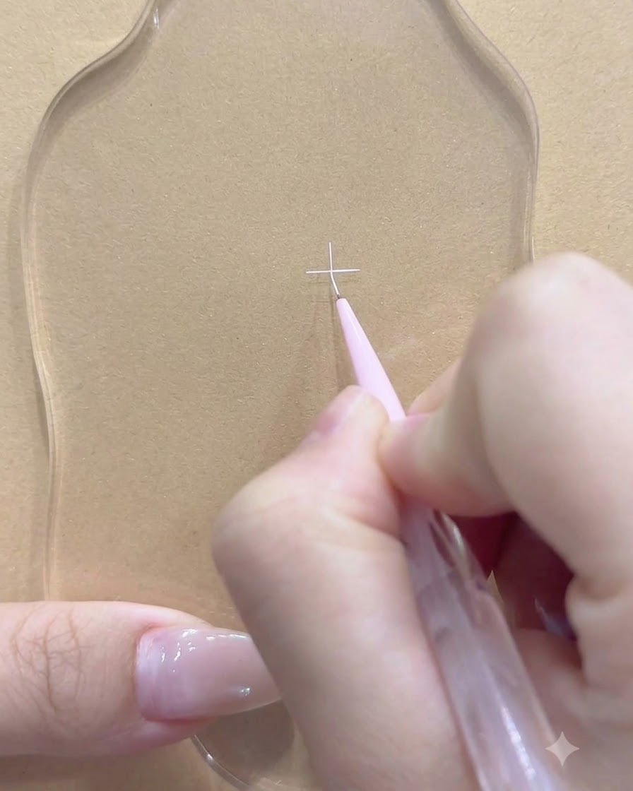Un pinceau fin ajoutant une ligne blanche sécante sur la palette transparente.