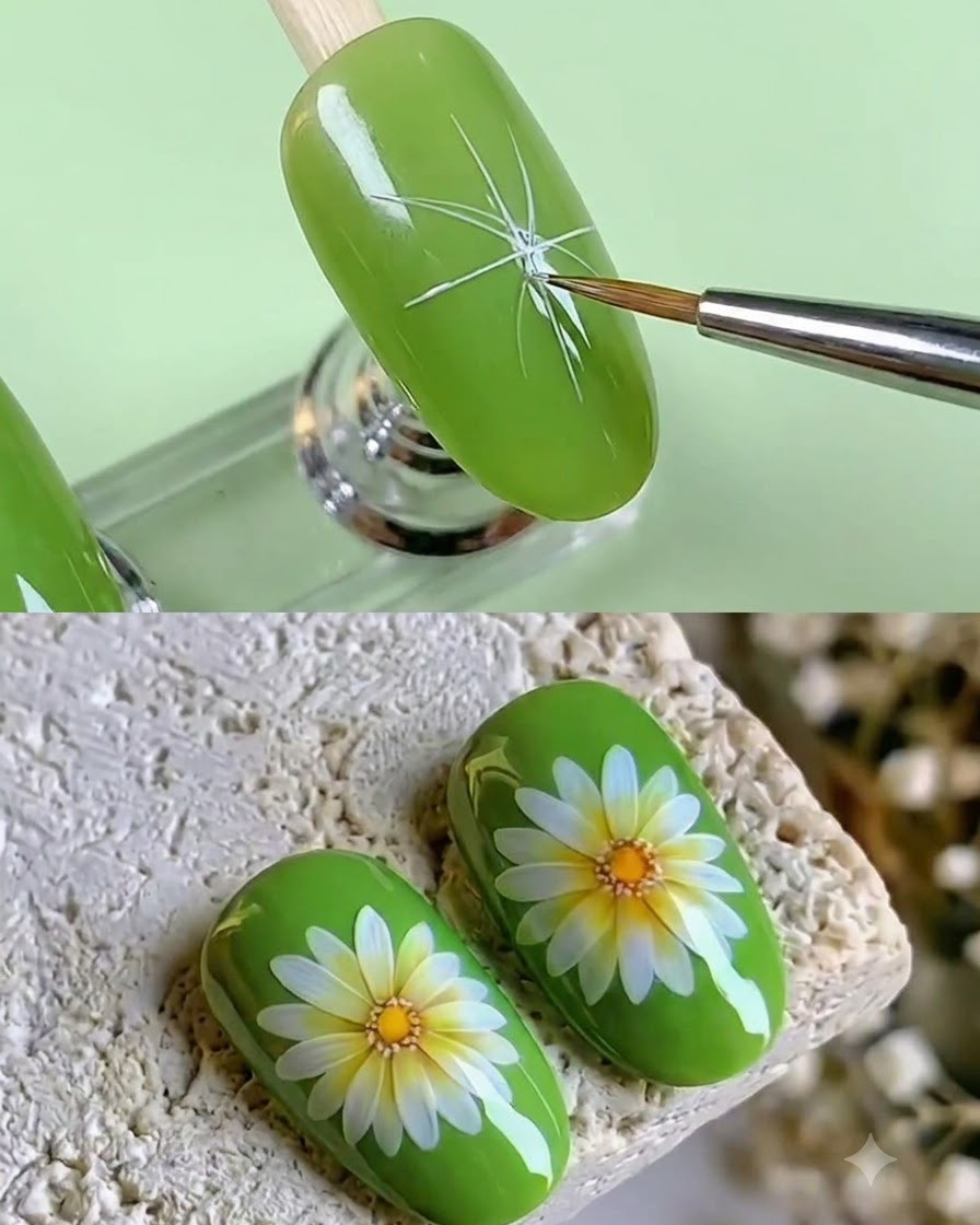 Un pinceau fin peignant des traits de pétales blancs allongés rayonnant à partir dun point central sur un ongle vert.