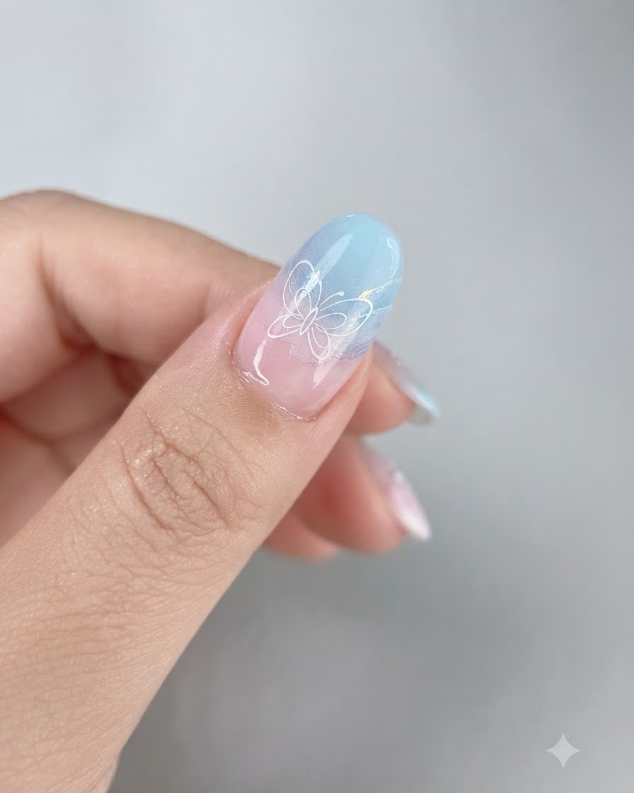 Un pinceau doux et touffu balayant la poudre iridescente libre dun ongle dégradé terminé.